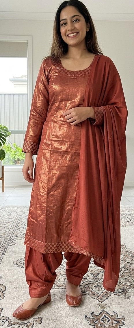 Rust round-neck salwar kameez with patterned cuffs and hem, matching salwar trousers and dupatta, plus size 52
